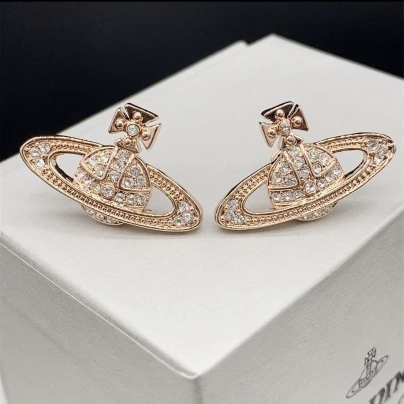 Boucles d'oreilles clous Saturne strass (paire)
